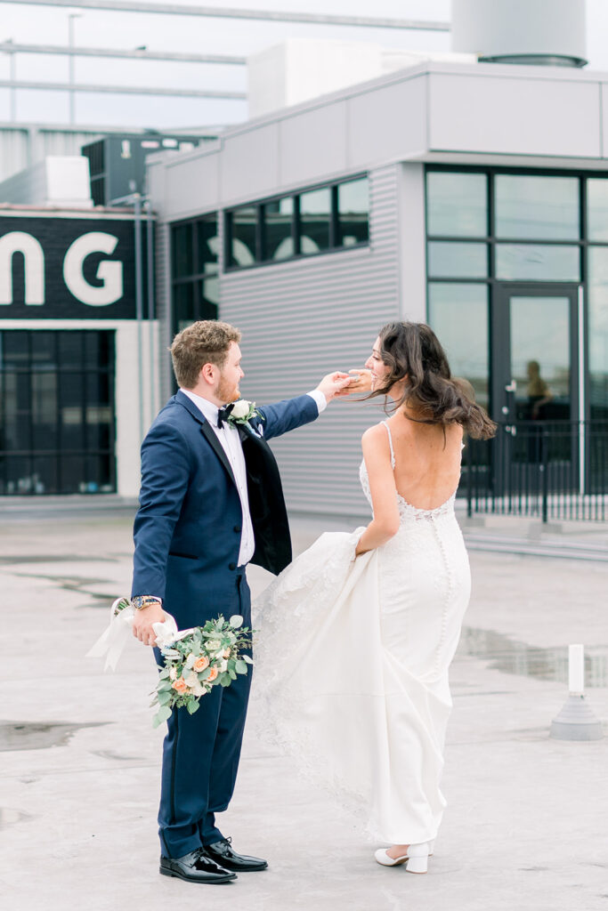 Groom spins bride in front of one of the Baltimore wedding venues