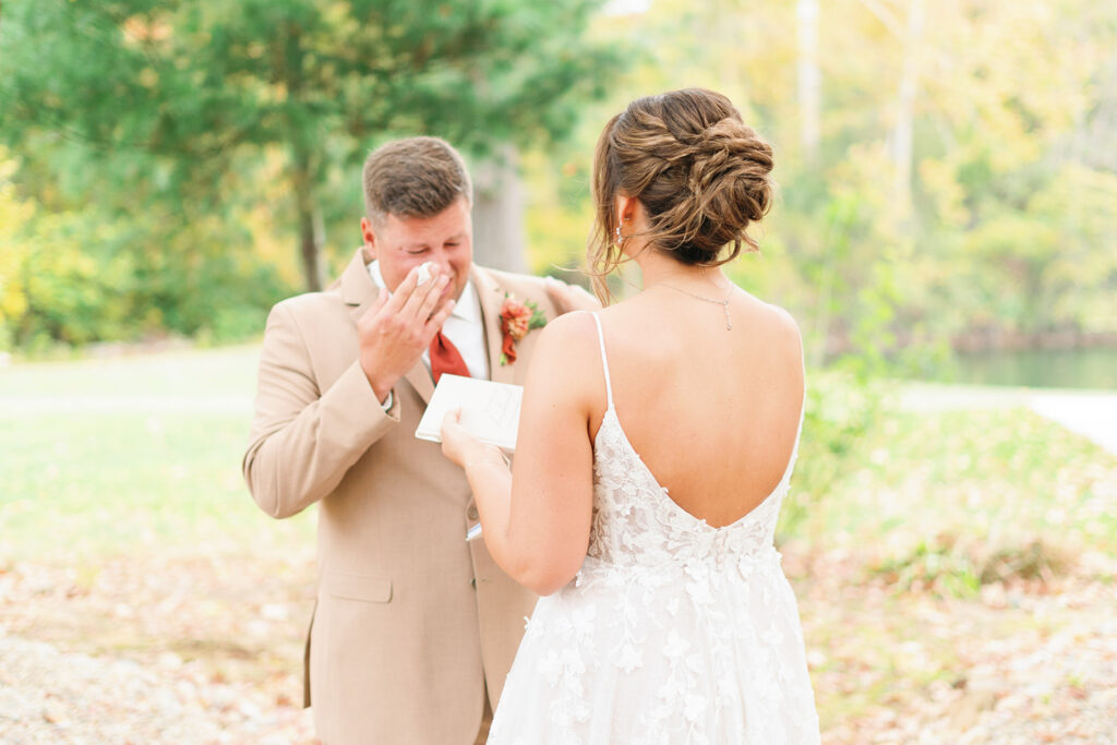 Groom gets emotional seeing bride in her wedding dress for the first time taken by Baltimore wedding photographer