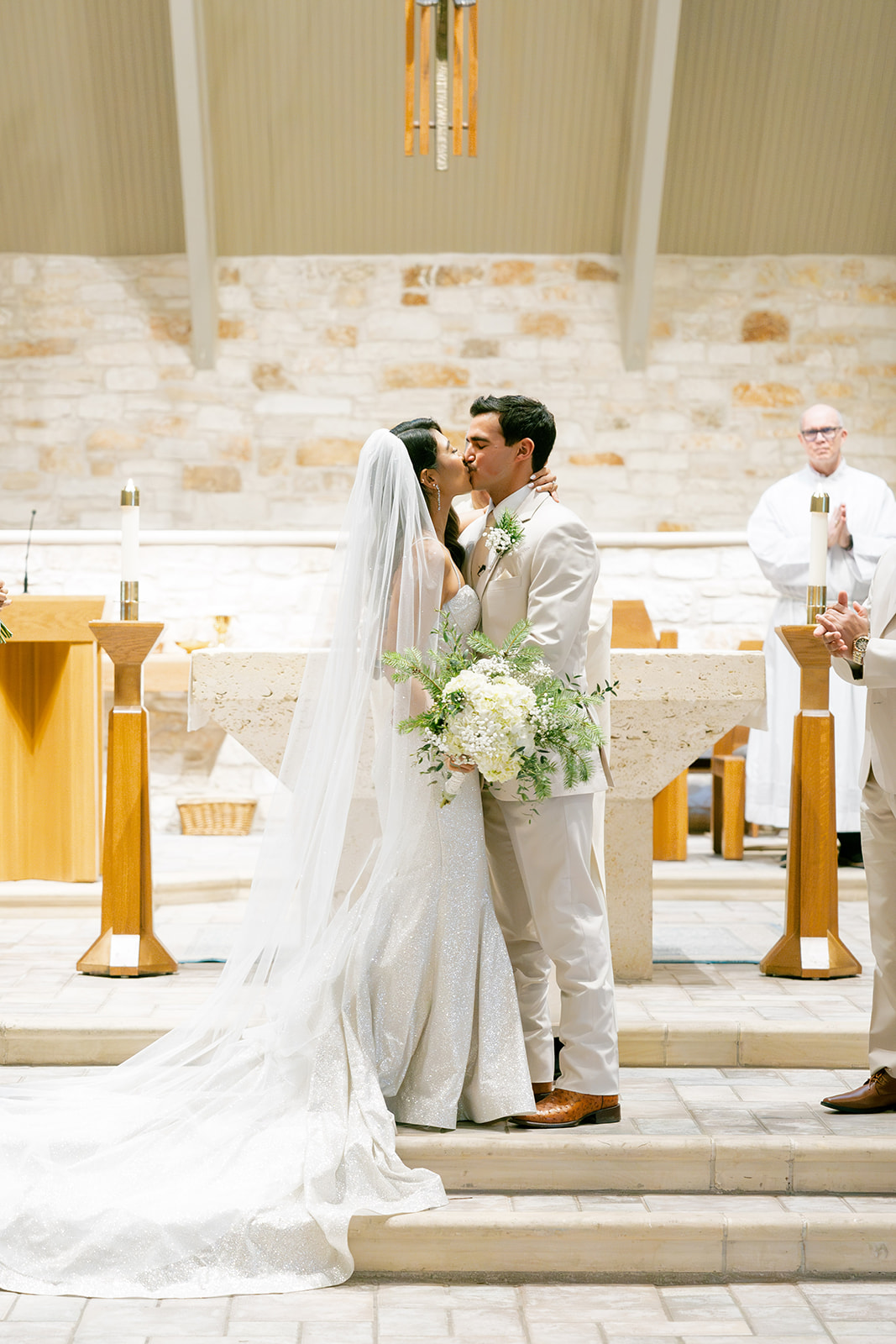 Bride and groom kiss at wedding ceremony without first look