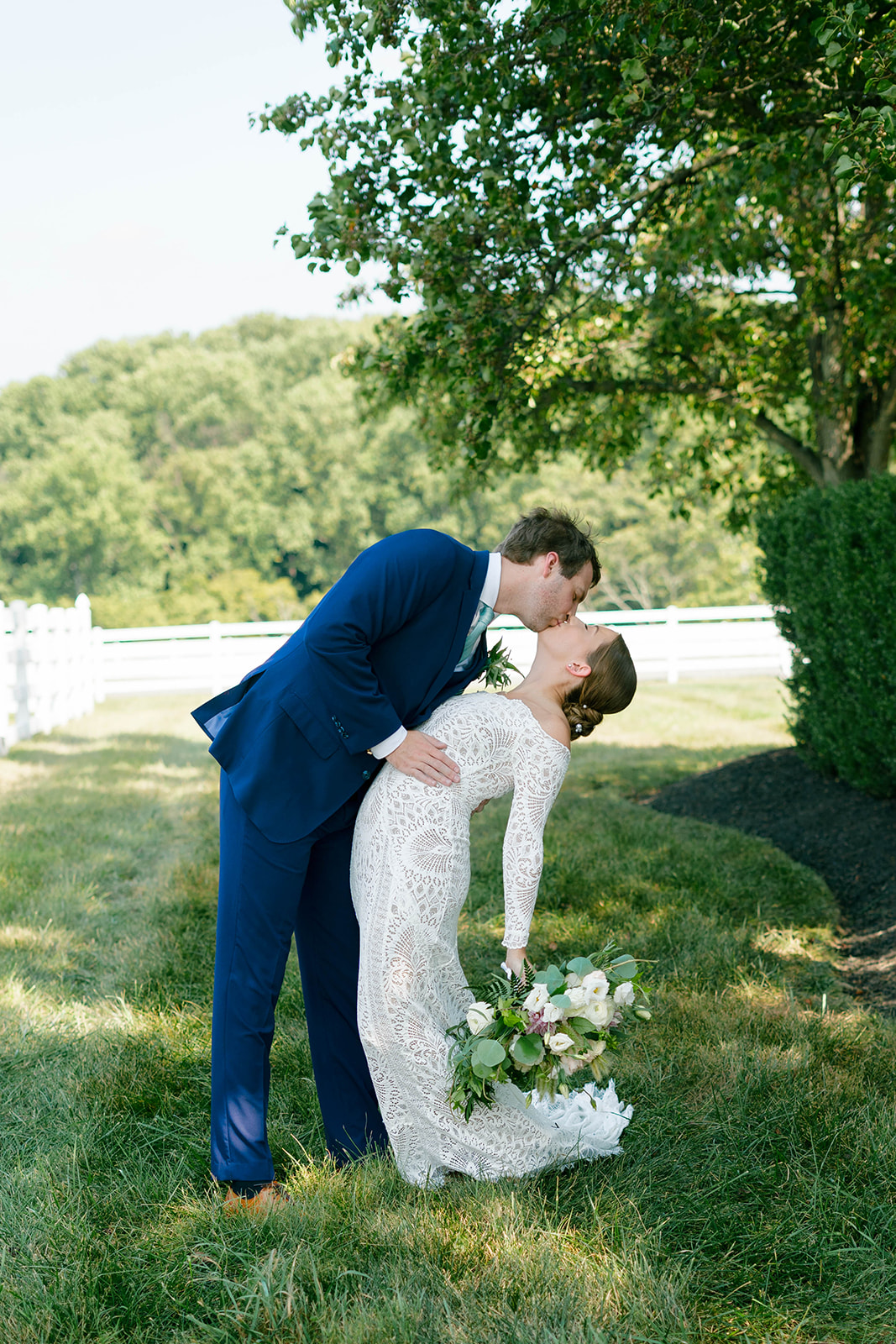 Bride and groom kiss at their Vignon Manor Farm wedding