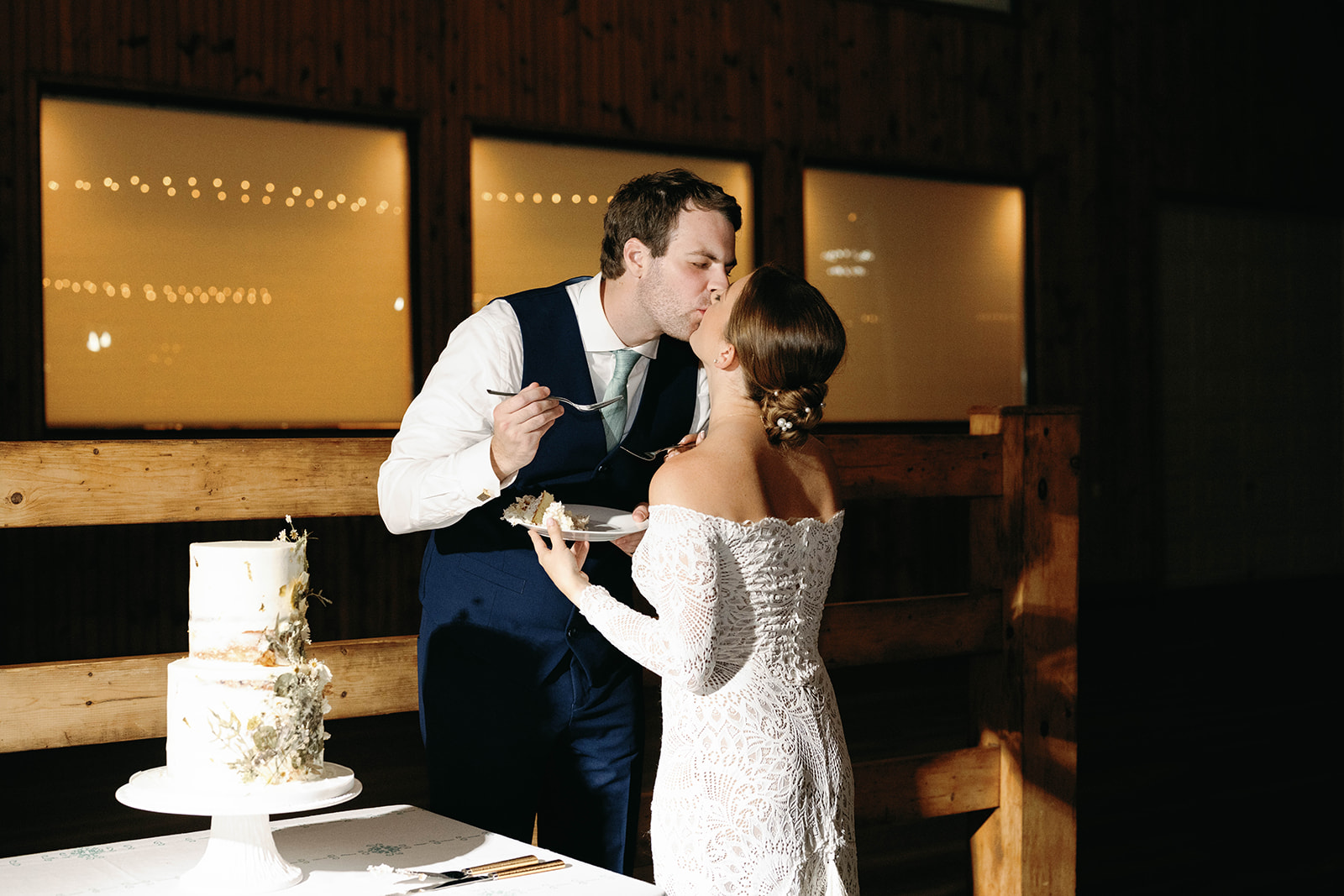 Bride and groom cut cake at their Vignon Manor Farm wedding