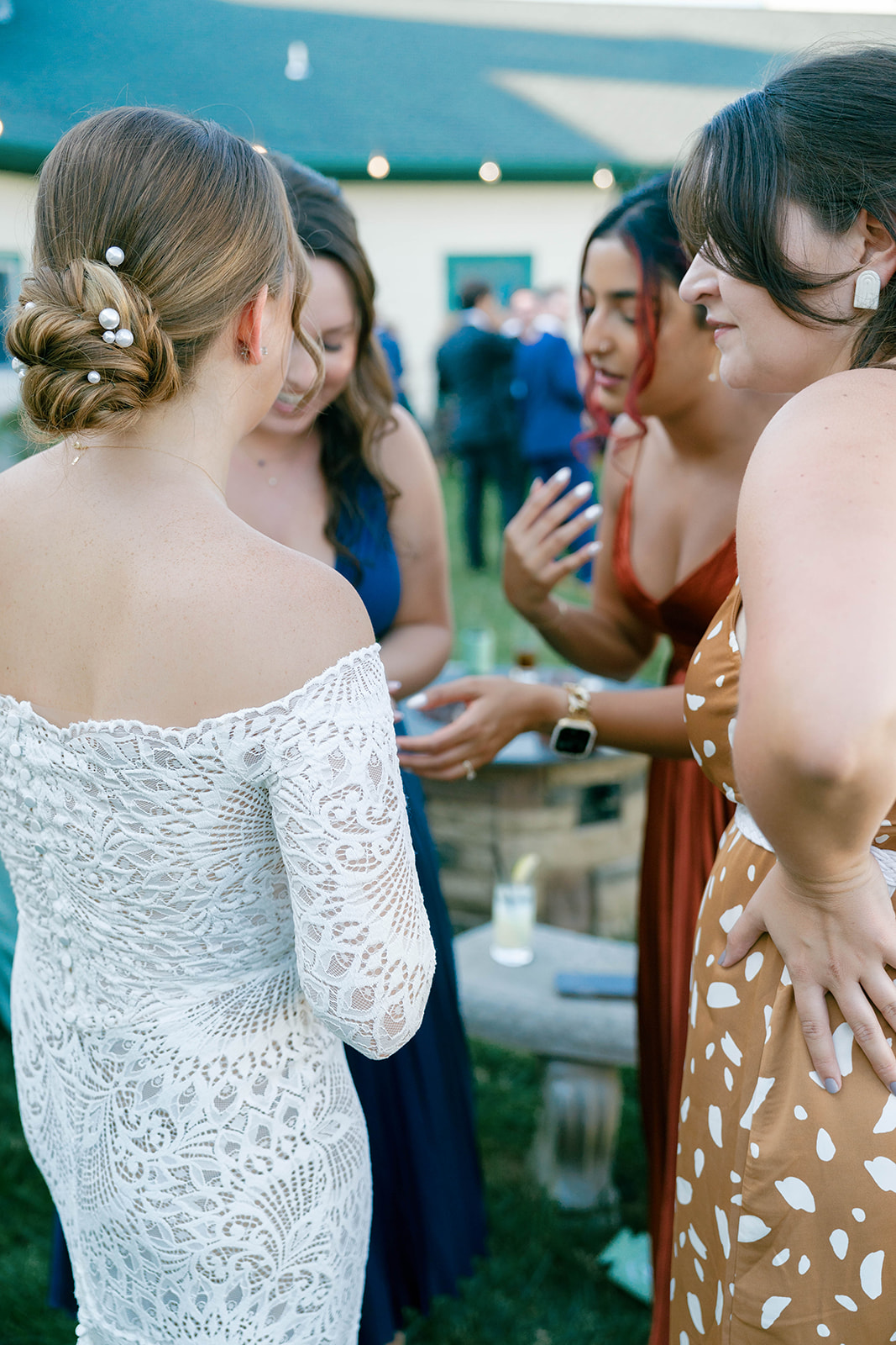 Bride enjoys cocktail hour at her Vignon Manor Farm wedding